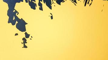 Black abstract paint splashes dripping on a bright yellow background. Black paint splashes on a yellow background. concept of art ideas. Paint brush texture yellow and black on background photo