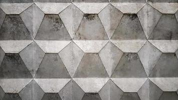 Background texture of an old gray concrete fence with a square pattern. Concrete wall. Soviet concrete texture fence, diamond-shaped fence photo