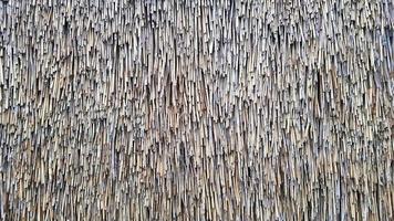 Straw pattern. Thatched grass, roof or wall. Straw, hay or dry grass roof background, thatch roof texture. photo