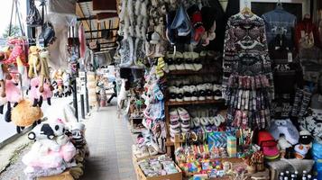 Souvenir market in Yaremche with traditional Carpathian handmade clothing, herbs and wooden tools. Ukrainian textiles, knitted socks, vests, hats. Ukraine, Yaremche - November 20, 2019 photo