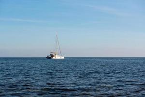 Sailboat off the coast of Formentera in the Mediterranean in Spain. photo