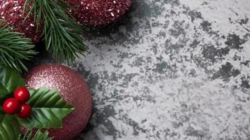 Christmas decorations, pine tree leaves, balls, berries on grunge background, Selective focus christmas concept photo