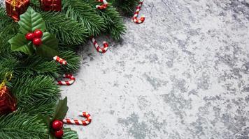 Christmas decorations, pine tree leaves, balls, berries on grunge background, Selective focus christmas concept photo