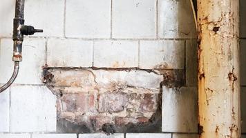 dirty old and dusty toilet in a public abandoned building. Ruined hygiene room. photo