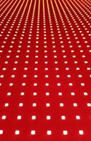 RGB LED screen panel texture. Close-up of a pixel LED screen with bokeh for wallpaper. Bright red abstract background perfect for any design. photo