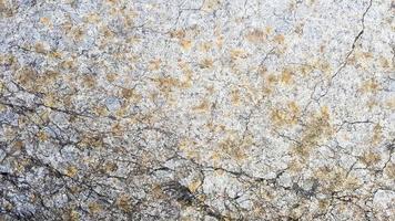 stone texture or background. Coarse cracked stone structure of the face. empty gray stone texture or background photo