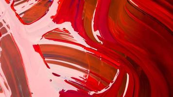 Abstract background of spilled red paint with buckets on a black backdrop. Red paint is pouring on a black background. Use it for an artist or creative concept. paints spilled red colored background photo