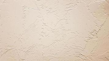 Light textured plaster as a background. Decorative plaster effect on wall. Textured background. Decorative plaster walls, external decoration of facade. Texture of beige. photo