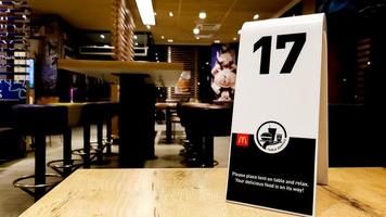 Ukraine, Kiev - September 9, 2019. 17 order number on the table in the McDonald's restaurant. Awaiting order at McDonald's Restaurant photo