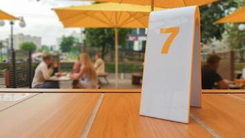 the order number on the table on the street in a McDonald's restaurant. Awaiting an order at a McDonald's restaurant. Fast food with invoice, check. Ukraine, Kiev - September 6, 2019. photo