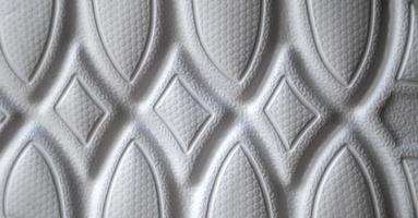 The outsole of new white sneakers. Rubber sole for men's shoes. Sole for sports and walking shoes. The texture of the material of sports shoes photo