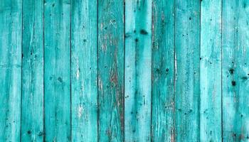 Old dark blue wood texture background. painted wooden wall. Blue background A bright fence made of vertical boards. The texture of a wooden board can be used for background. A little cracked paint. photo