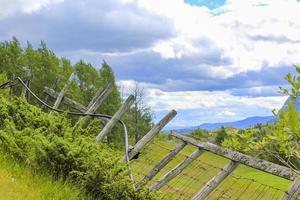 Stunning Norwegian landscape behind a broken fence in Hemsedal, Norway. photo