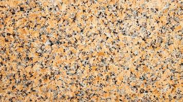 Real natural brown granite pattern, polished mineral slice. Seamless cracked marble damaged concrete texture. Architectural background. Brown spots on a stone background. marbling photo