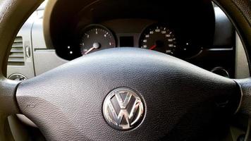 Ukraine, Kiev - August 21, 2019. Volkswagen logo, close-up of the dashboard, speedometer, tachometer and steering wheel. modern car interior photo