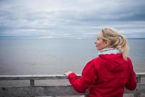 Looking at the Ocean on a cold Autumn Cloudy Day photo