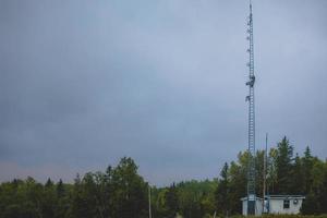 Telecom Worker Climbing Antenna Tower photo