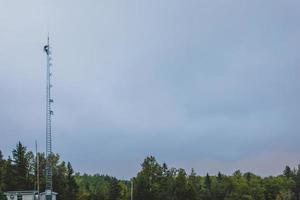 Telecom Worker Climbing Antenna Tower with photo