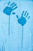 Fingerprints of blue paint photo