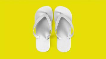 Tropical white sandals isolated on yellow background. suitable for your design element. photo