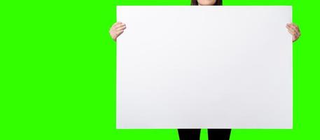 Beautiful Woman holding blank signboard on green screen background. suitable your element project. added copy space for text. photo