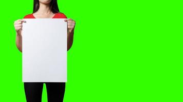 Beautiful Woman holding blank signboard on green screen background. suitable your element project. added copy space for text.