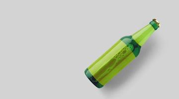 Top up view green beer bottle with blank yellow template isolated on grey background. beer fiesta concept. photo