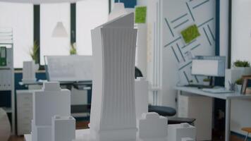 Close up of building model and urban structure on table in empty office video