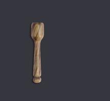 Close view olive wooden spice spoon isolated on dark background. suitable for your design element. photo