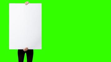 Beautiful Woman holding blank signboard on green screen background. suitable your element project. added copy space for text.