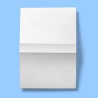 Back to school concept , hard cover blank white upside down open isolated on blue photo