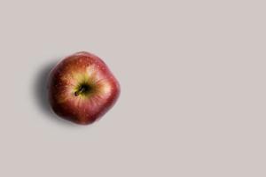 Top up up view fresh red apple isolated on grey background. suitable for your design project. photo