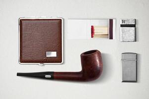 Set of tobaccos equipment over white background. photo