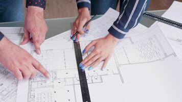 Close up of architects making changes to a house project video