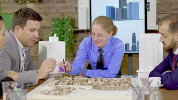 Female architect in a meeting with her team in the conference room video