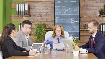 Female manager presents new project plan to colleagues at meeting video