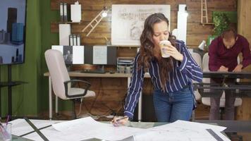 Female construction engineer taking a sip of coffee video