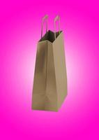 Close up view of Shopping bag from craft paper with handles on white background , 3d Rendering isolated illustration. suitable for your element design. photo