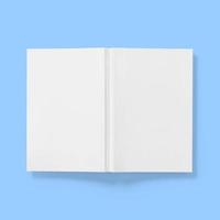 Back to school concept , hard cover blank white book upside down open isolated on blue. photo