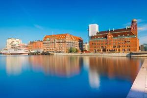 Malmo cityscape reflected in water, Sweden photo