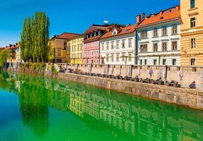 View of the Ljubljanica river in the center of Ljubljana. Colorful historical buildings reflected in the water photo