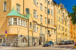 A street in Helsinki with the traditional Scandinavian architecture, bright yellow residential buildings, Finland photo