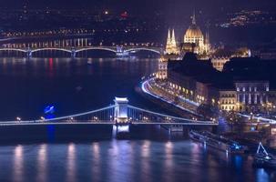 Night view of Budapest, building of The Hungarian Parliament and Chain Bridge, main landmarks in the city photo