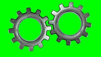Two gears turning on green background. Concept of work teams and business skills development video