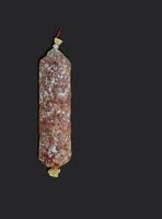 Rustic goat sausage on Black background. Top view. Copy space for text