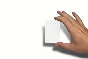 Naturally groomed male hand holding a blank white business card. Room for copy. photo