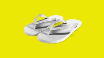 Tropical white sandals isolated on yellow background. suitable for your design element. photo
