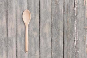 Top up view wooden spoon on dark wooden vintage table . added copy space for text , suitable for your food or drink concept background. photo