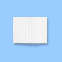concepto de regreso a la escuela, libro blanco en blanco de tapa dura boca abajo abierto aislado en azul. foto