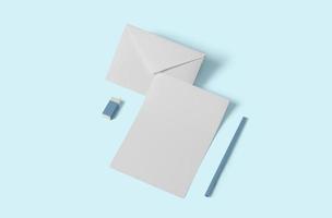 maqueta de papelería vacía blanca, agregue su diseño. simple concepto de regreso a la escuela aislado en azul suave. foto